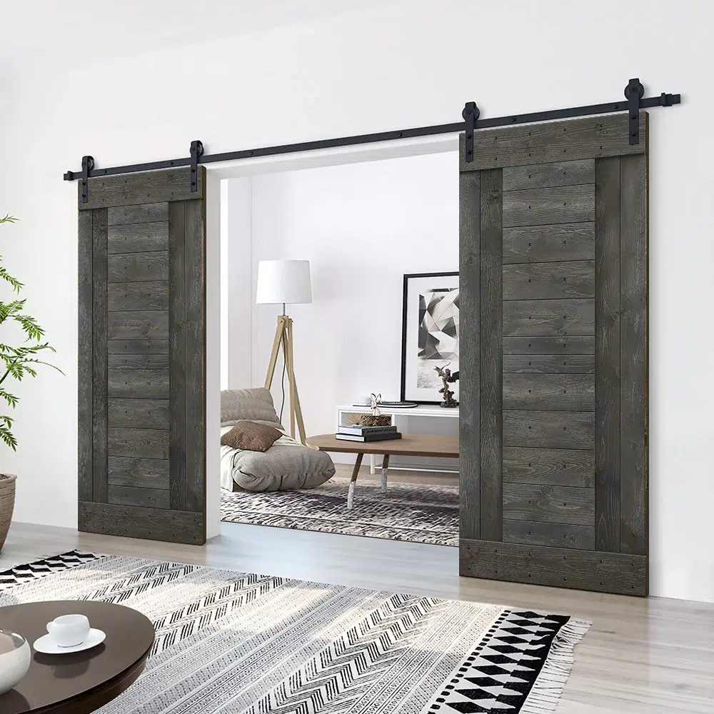 Pair of weathered dark gray sliding barn doors with horizontal planks on a black track