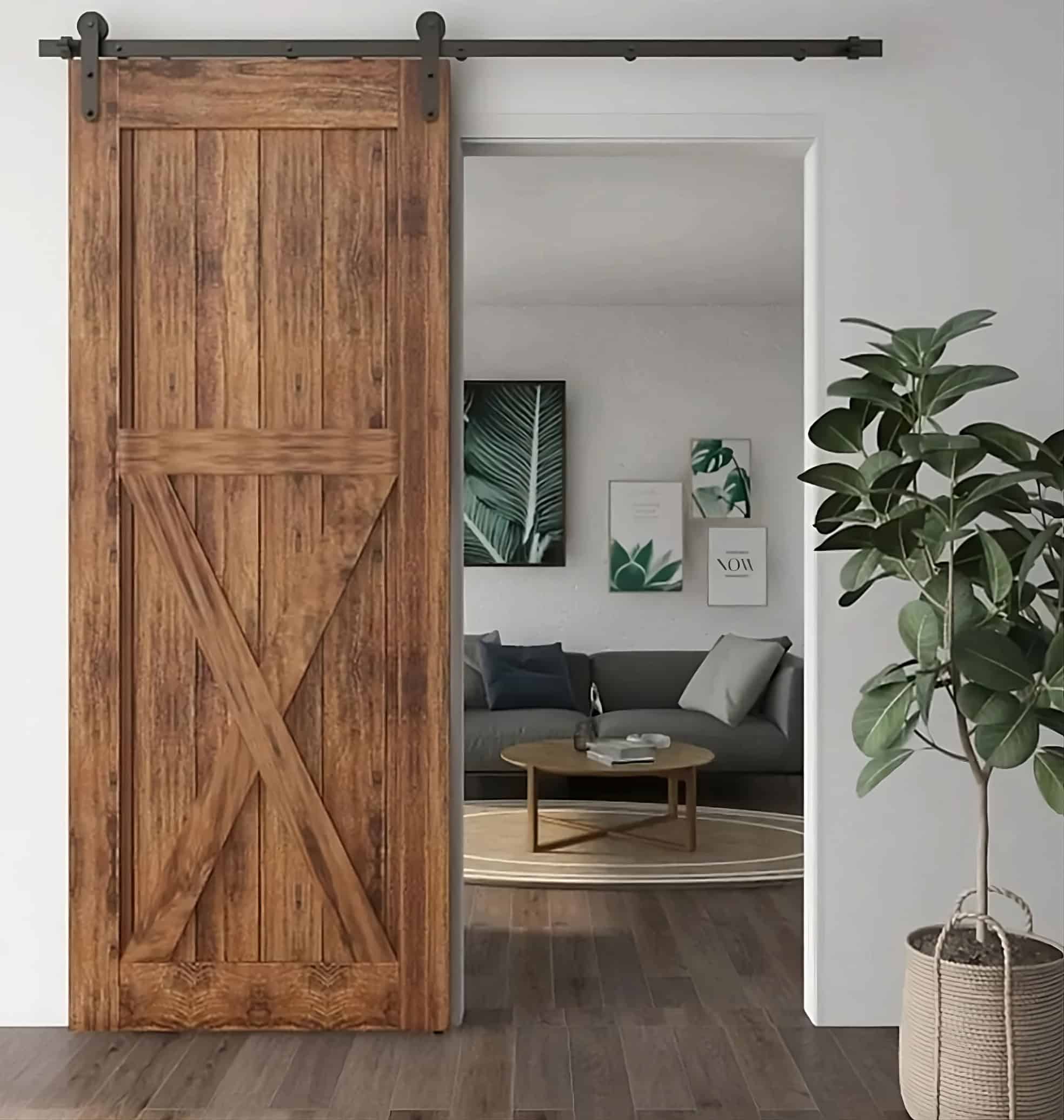 Dark wood sliding barn door with a large lower X-brace opening to a living room