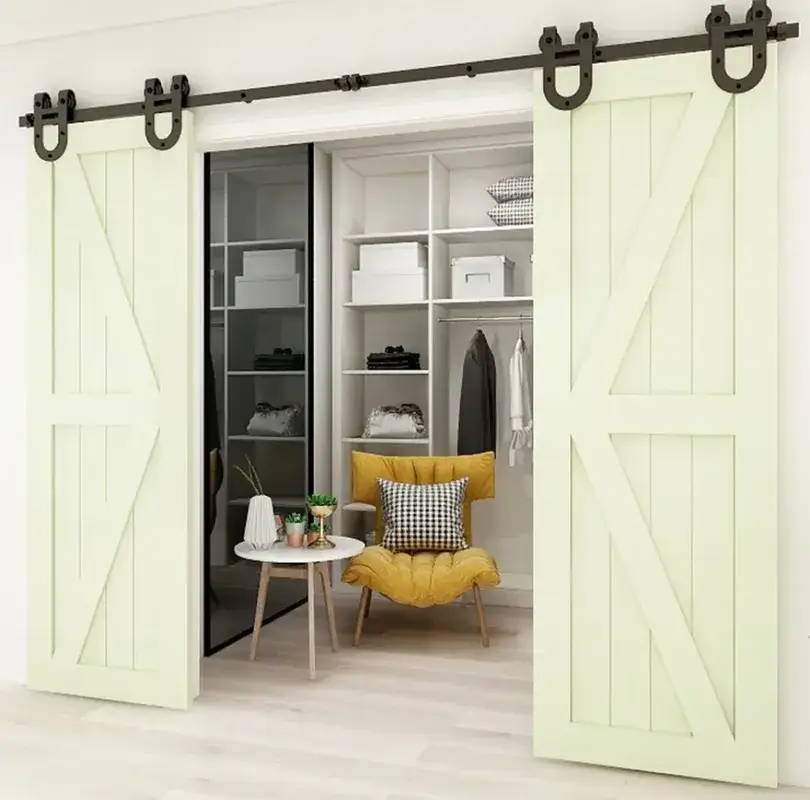 Double off-white K-brace barn doors opened to reveal closet shelving