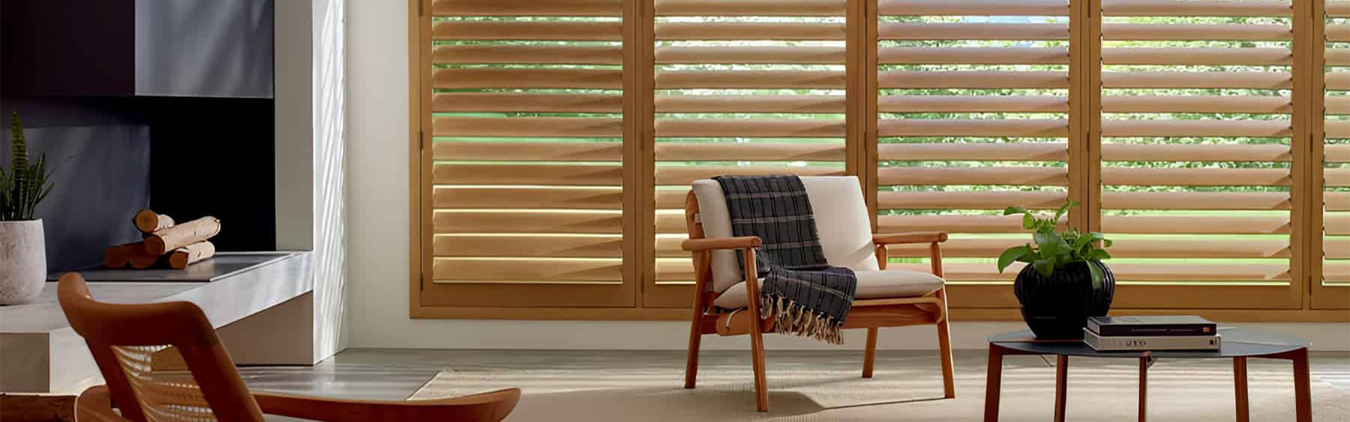 Natural wood shutters installed in a modern living room