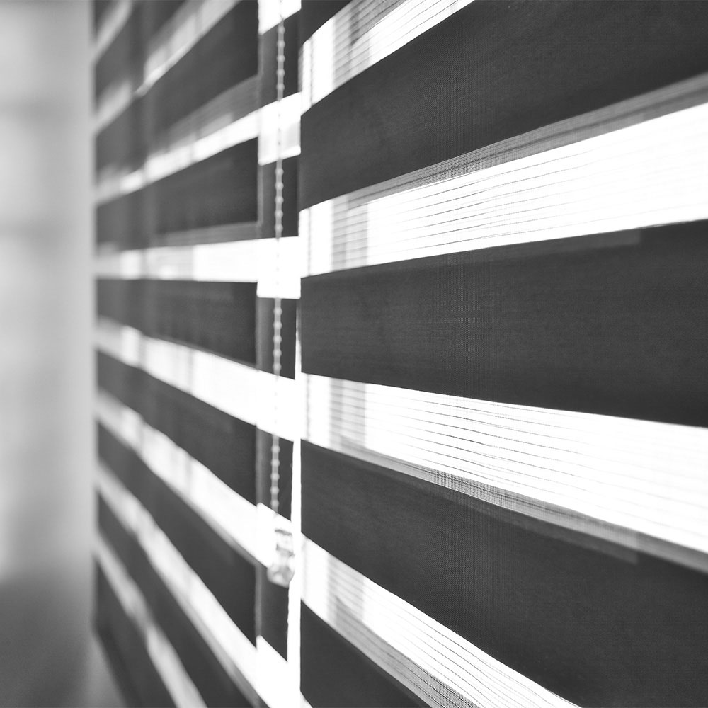 Close-up of contrasting black and white zebra shade bands